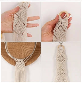 Detail of bohemian macrame hat organizer with handwoven cotton rope and wood ring