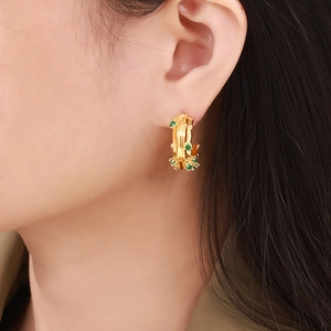 18k gold plated geometric C-shaped earrings with green glass stones in bamboo design