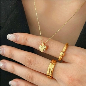 Elegant 925 sterling silver gold heart necklace and ring set with zircons on model