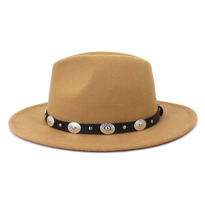Detail of camel wool fedora hat featuring a black faux leather belt with metal buckles