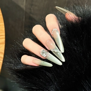 Champagne cat-eye press-on nails with luxury rhinestones and long almond shape design