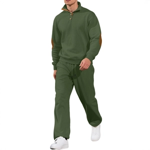 Men's green textured knit tracksuit with half-button collar and brown elbow patches