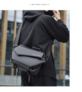 Detail view of water-resistant matte black tactical crossbody bag with nylon straps