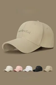 Detailed close-up of 'wonderful' gold embroidery and stitching on a cotton baseball cap