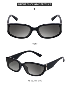 Front and side view of trendy glossy black sunglasses with grey-green gradient lenses