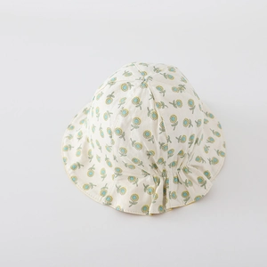 Detail of baby sun hat featuring yellow sunflower print and pleated back design
