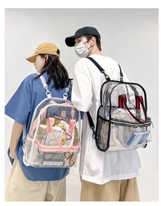 Detail of transparent PVC backpacks featuring pink and black adjustable shoulder straps