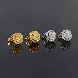 Detail view of round hip hop stud earrings in gold and silver with zircon micro-pave