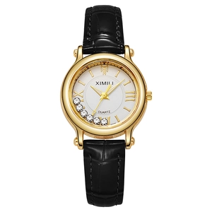 Minimalist gold quartz watch with small dial, mobile diamonds and black leather strap