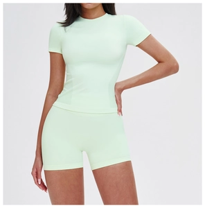 Close-up of mint green seamless high-waist yoga shorts with side breathable mesh texture