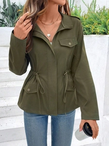 Detailed close-up of army green utility jacket with drawstring waist and metal buttons