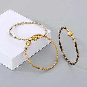 Detailed view of 3mm braided cable bracelets with lucky heart and bear charm clasps