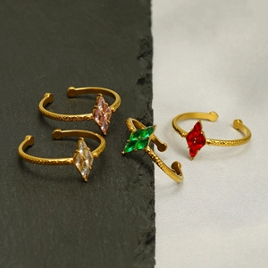 Adjustable gold stainless steel rings with colorful marquise-cut zircons on black stone
