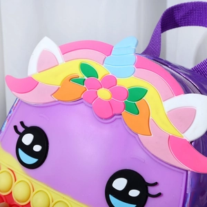 Detail of unicorn fidget backpack showing colorful silicone pop bubbles and purple texture