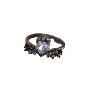 Saturn crown ring with black metal heart-shaped stone and pink zircon accents