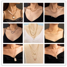 Detailed collage of luminous turtle pendants and diverse gold-tone layered fashion necklaces