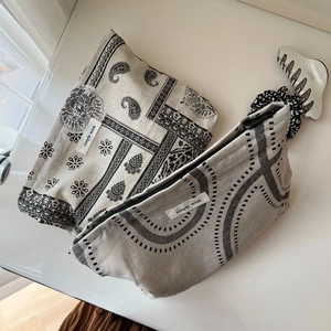 Close-up of vintage cotton linen makeup bags with mandala prints and zipper closure