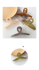 Detail of large matte shark hair clips in four elegant colors with a sturdy metal spring