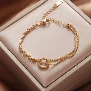Asymmetric gold titanium steel bracelet featuring paperclip and double bead chains