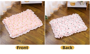 Double-sided quilted pet mat with pink rainbow print and ruffled edges detail