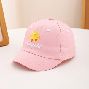 Close-up of pink cotton baby hat featuring cute yellow chick embroidery and text detail