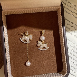 Gold-plated pony earrings with pearls and zircon set in a vintage jewelry box