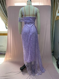 Detail of purple sequin evening dress with delicate mesh overlay and strap design