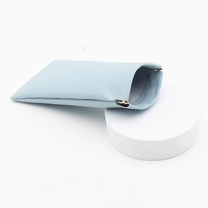 Light blue minimalist faux leather storage pouch with automatic magnetic closure for glasses