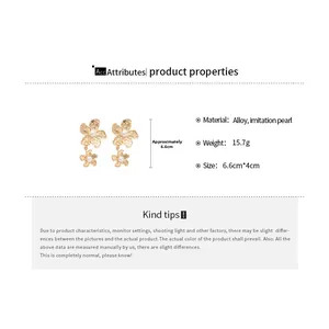 Detailed size parameters of gold flower earrings with pearls measuring 6.6cm by 4cm