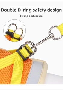 Detail of escape-proof pet harness with double D-rings and breathable orange mesh fabric