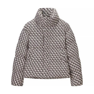 Short puffer jacket with black and white geometric pattern and cozy stand collar