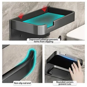 Wall-mounted matte black bathroom tissue holder with a storage shelf and non-slip hook