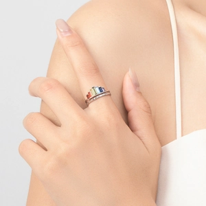 Elegant s925 silver crown ring with rainbow gemstones on a female model finger