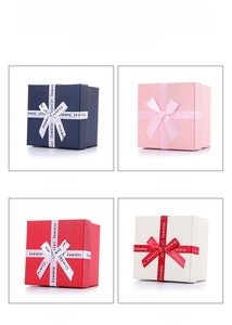 Detailed grid showing square jewelry gift boxes in navy, pink, red, and white with bows