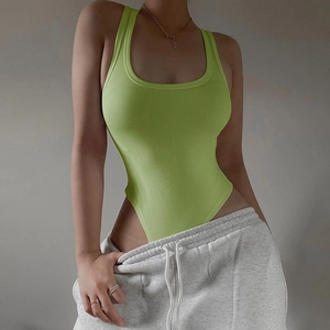 Detail of neon green ribbed knit bodysuit featuring a U-neckline and slim fit texture