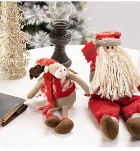 Detail of soft plush Reindeer and Santa dolls with Bienvenue welcome sign for Christmas