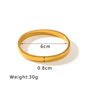 Polished gold stainless steel bangle with 6cm diameter and 0.8cm width dimensions