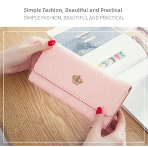 Pink quilted leather long wallet with golden crown emblem and flap closure detail