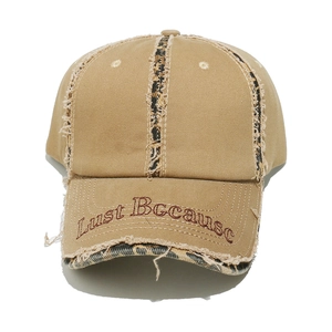 Detailed view of leopard print stripes and Lust Because embroidery on distressed baseball cap