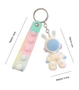 Detailed size view of cute rabbit astronaut keychain with colorful silicone pop-it strap