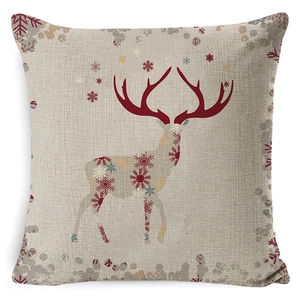 Detail of square Christmas pillowcase with red snowflake reindeer pattern on linen fabric