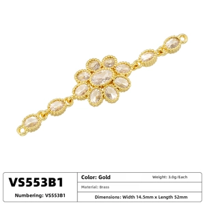 Detail of gold brass connector with three cubic zirconia flowers for jewelry making