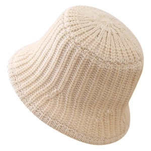 Women's warm cream knit bucket hat with thick vertical ribbed texture for winter style
