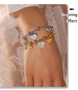Wearing effect of gold and silver heart bracelets with sparkling crystal pavé details