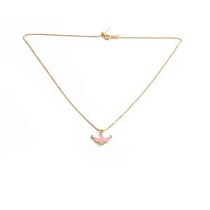 Close-up of a gold-plated necklace featuring a pink crown pendant with tiny gemstone accents