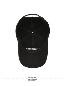 Detail view of the black cotton baseball cap interior showing stitching and brim embroidery