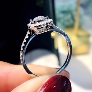 Luxury halo setting round cut diamond ring for women featuring micro-pave side stones