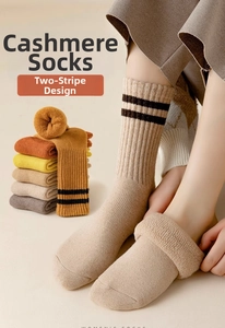 Detailed knit texture of wool cashmere socks with striped ribbed cuffs for winter
