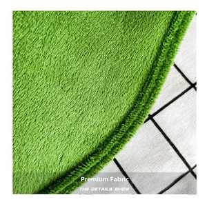 Close-up of soft green plush fabric texture and neat edge stitching on the pea bag