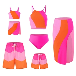 Detailed flat lay of pink and orange geometric color block family swimwear set